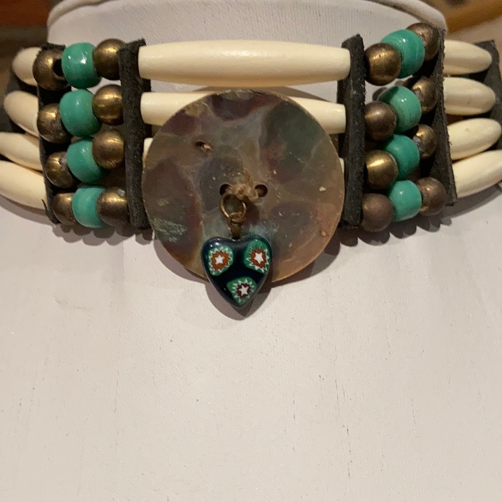 A four strand choker with a shell centerpiece
